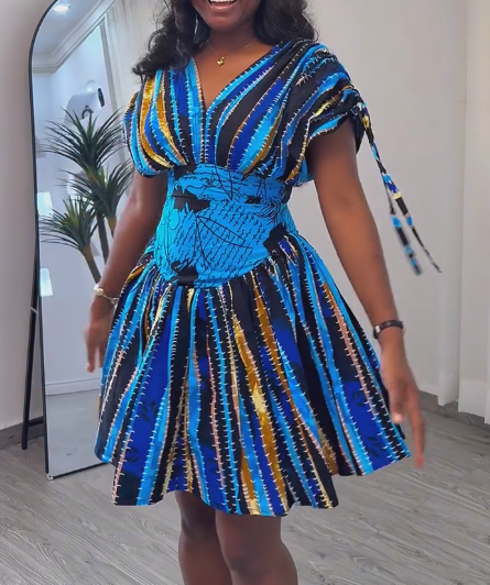 Waisted dress with tie cuffs