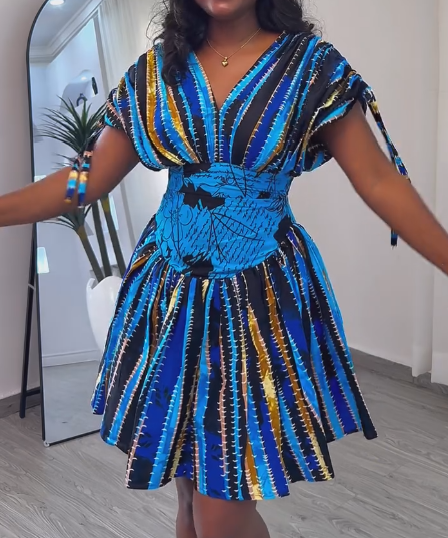 Waisted dress with tie cuffs