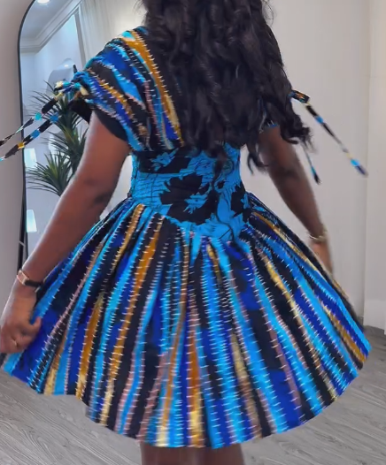 Waisted dress with tie cuffs