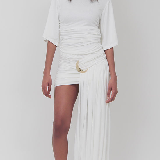 Irregular length pleated skirt
