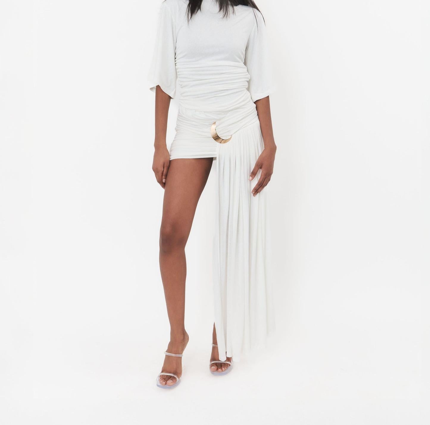 Irregular length pleated skirt