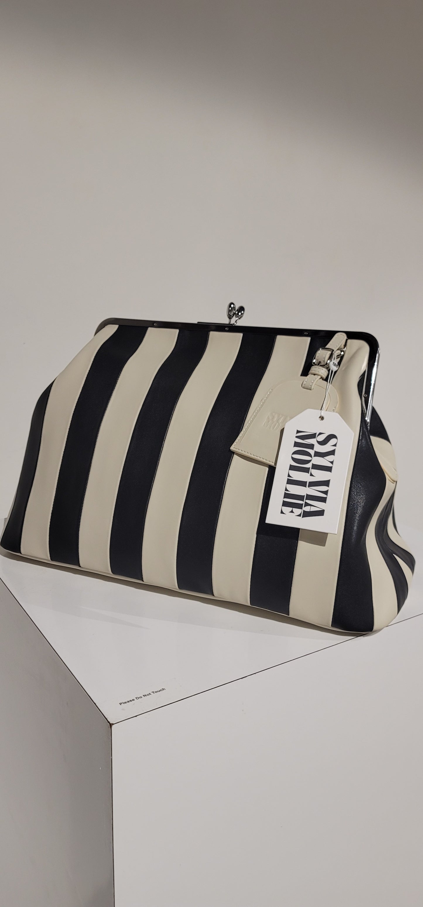 Embossed premium leather stripe kiss lock bag