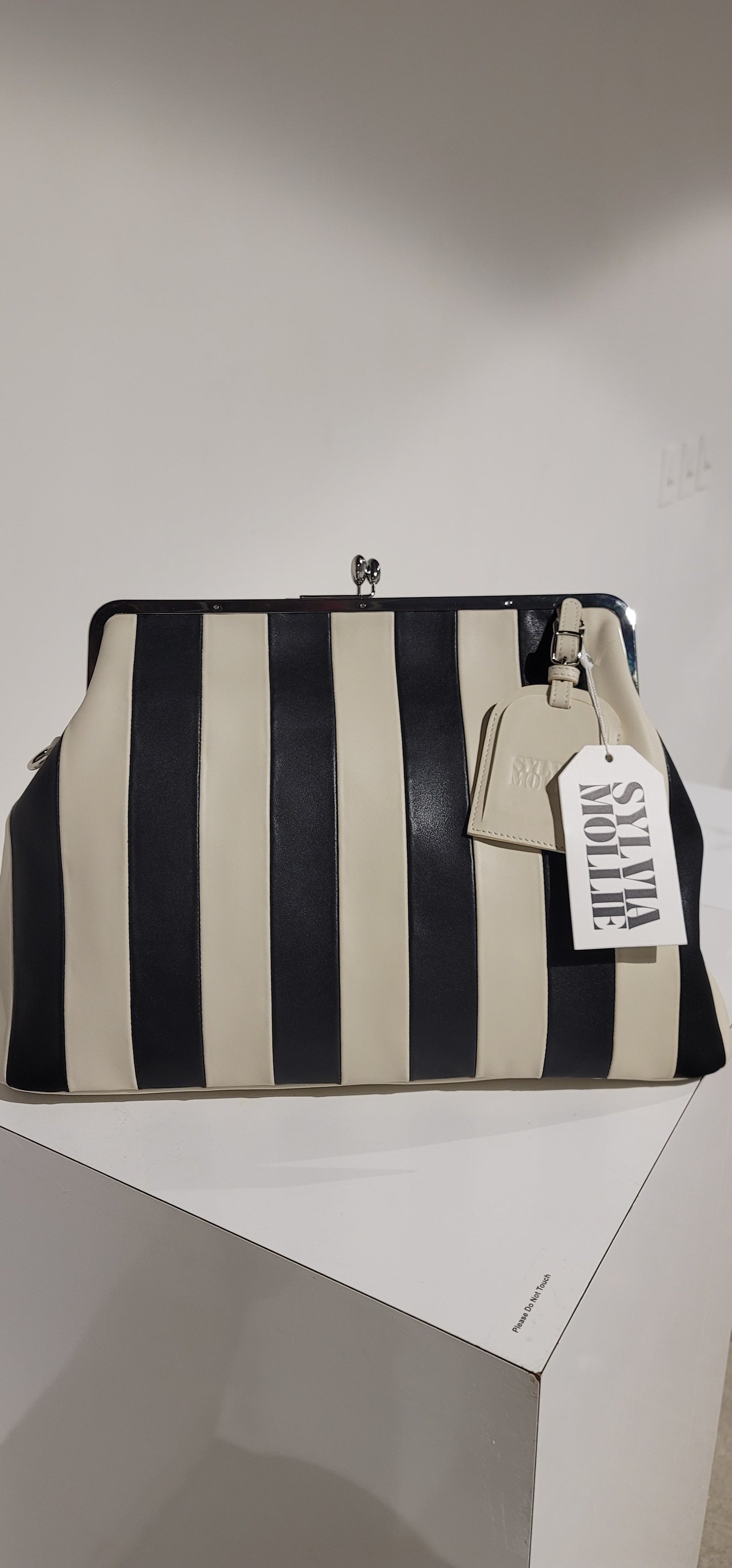 Embossed premium leather stripe kiss lock bag