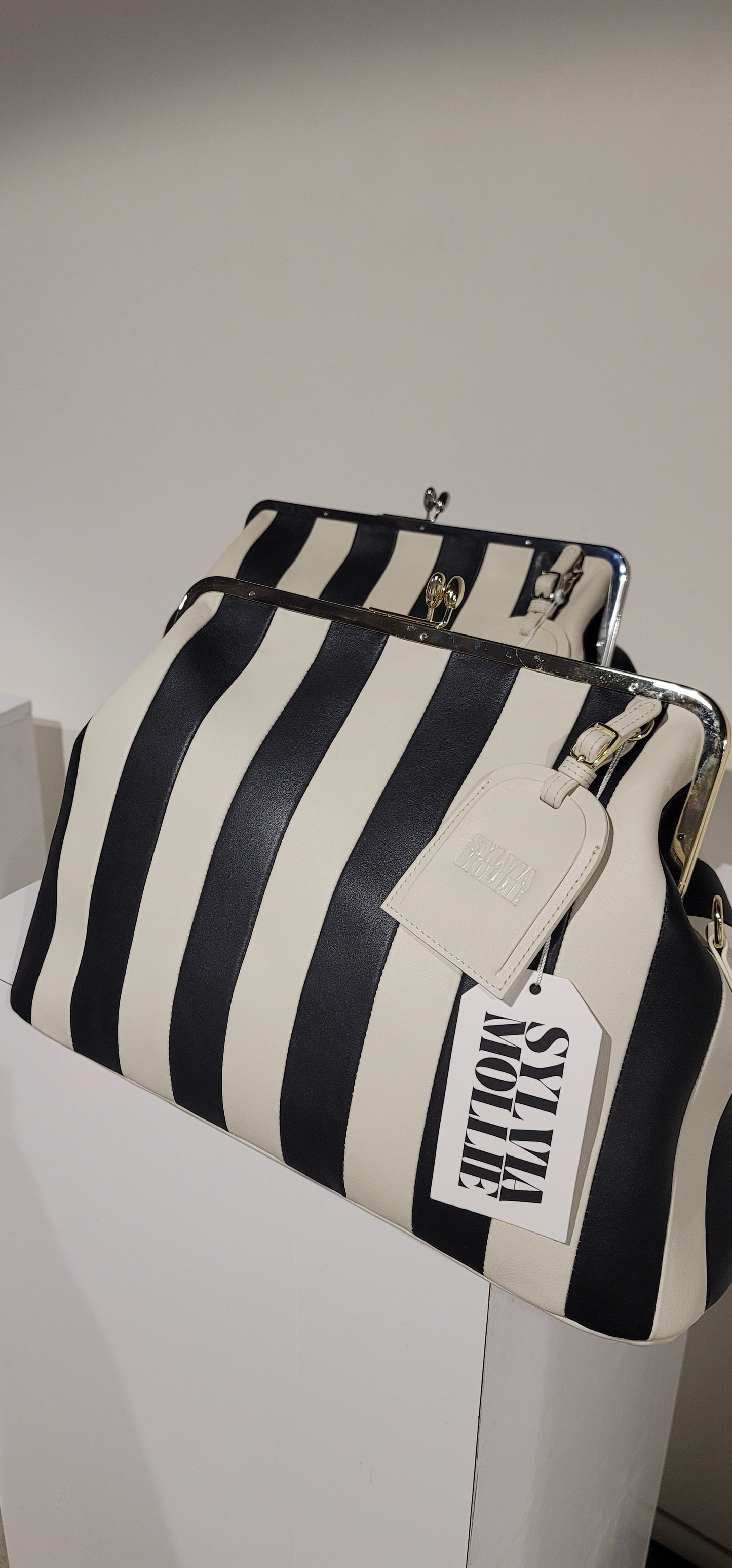 Embossed premium leather stripe kiss lock bag