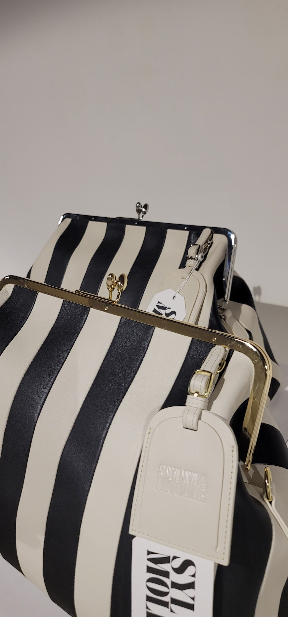 Embossed premium leather stripe kiss lock bag