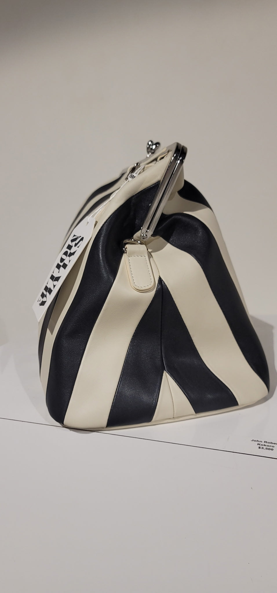 Embossed premium leather stripe kiss lock bag