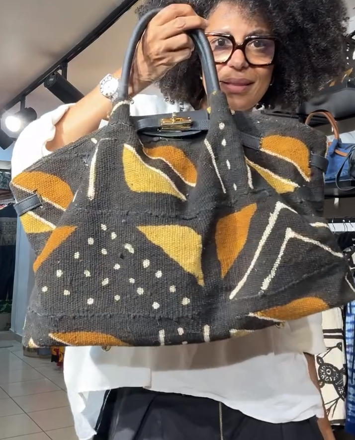 Leather-handled batik handbag