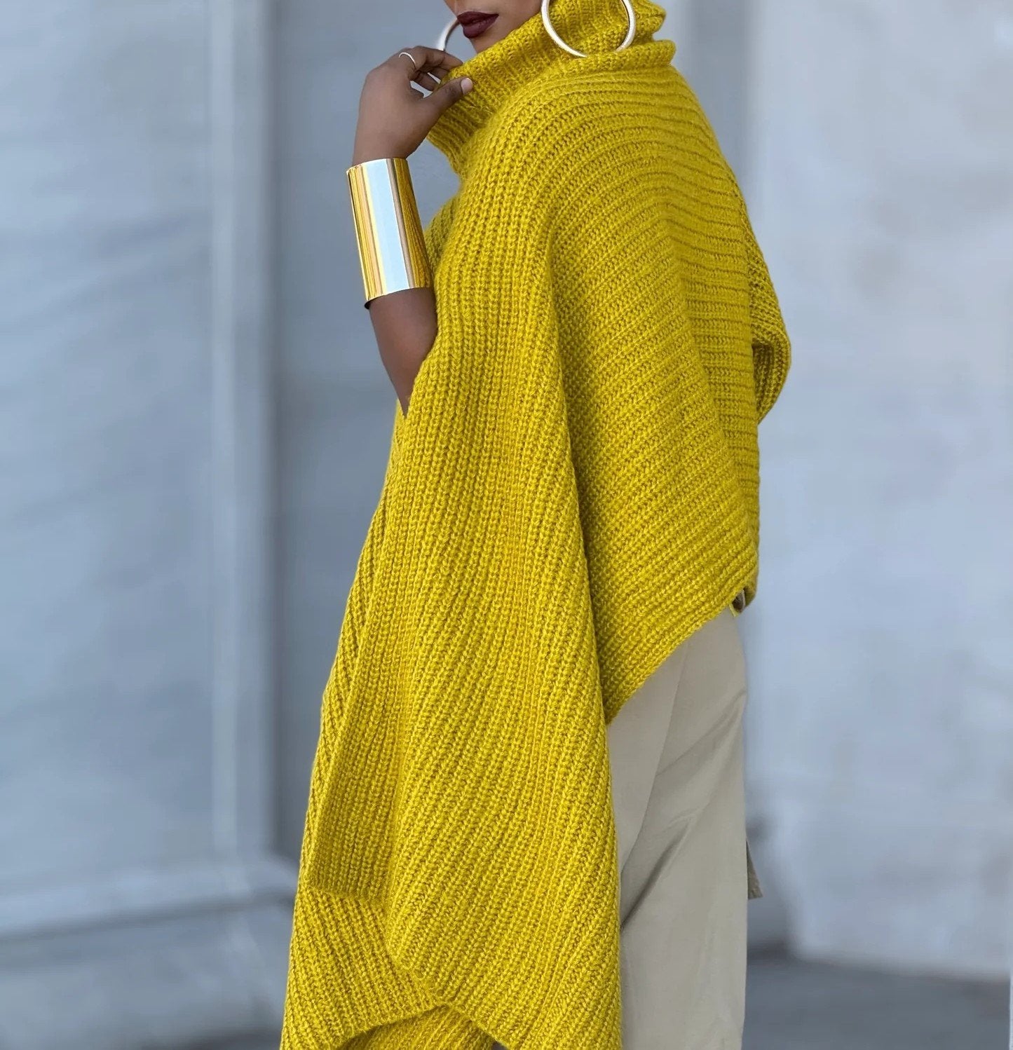 Yellow turtleneck knitted cape