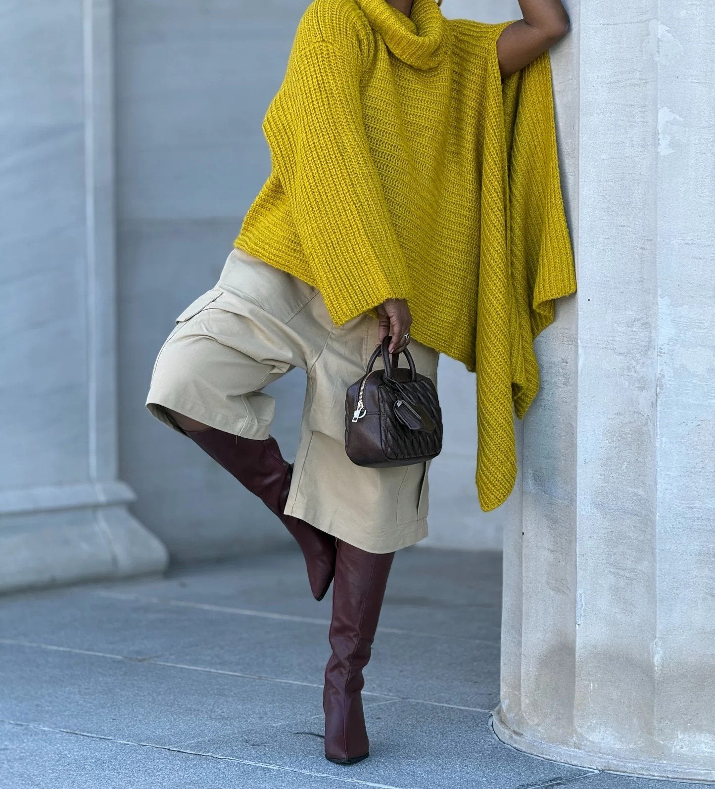 Yellow turtleneck knitted cape