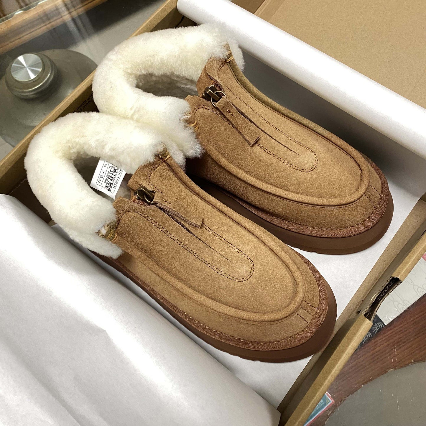 Front-zip shearling one-piece snow boots