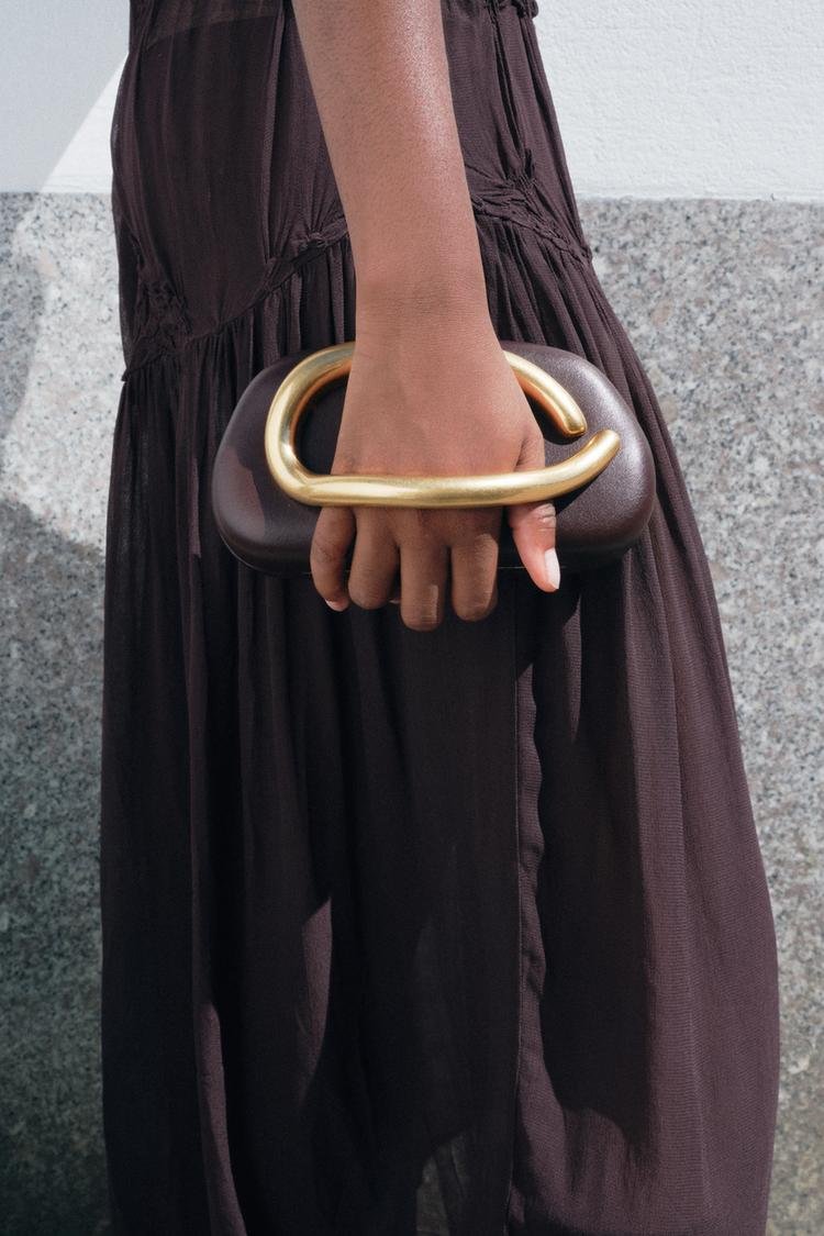 Metal embellished clutch