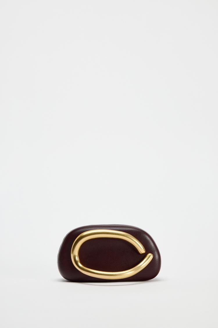 Metal embellished clutch