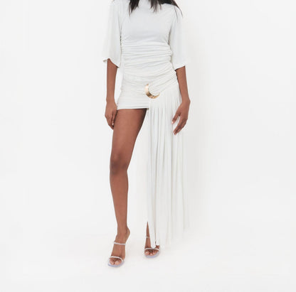 Irregular length pleated skirt