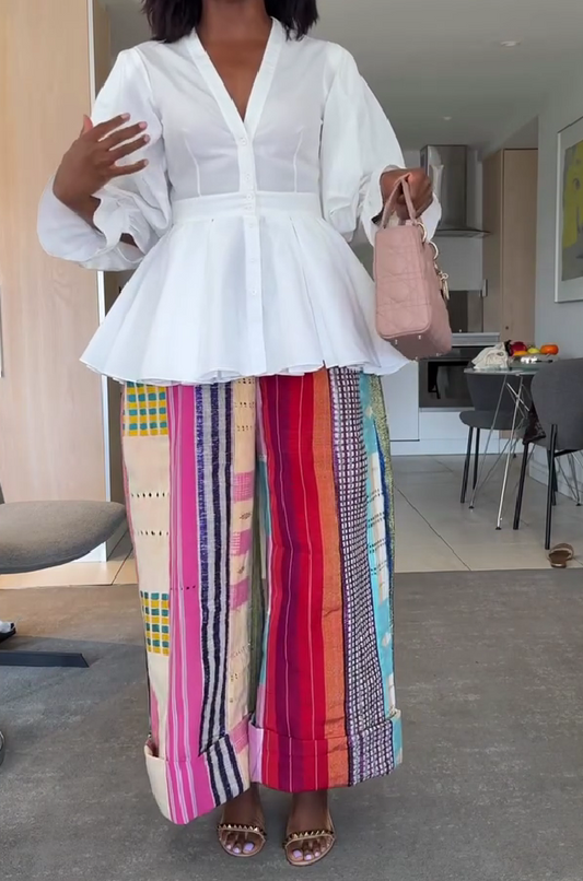 White ruffled top + colorful stitching wide-leg pants
