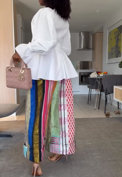 White ruffled top + colorful stitching wide-leg pants