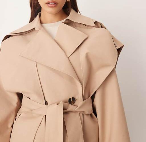 Double-breasted short trench coat with cape details