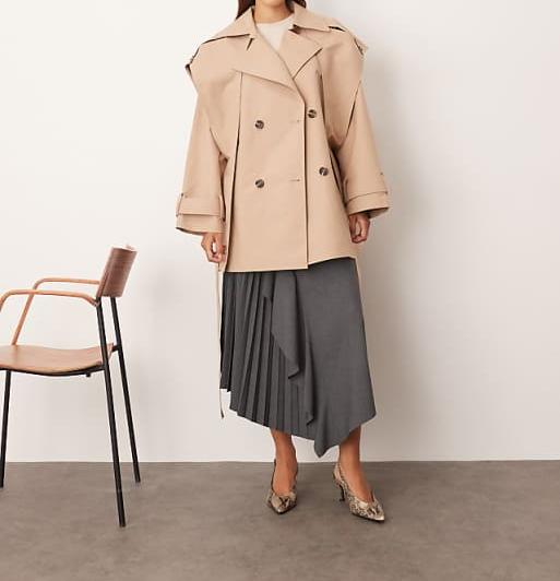 Double-breasted short trench coat with cape details