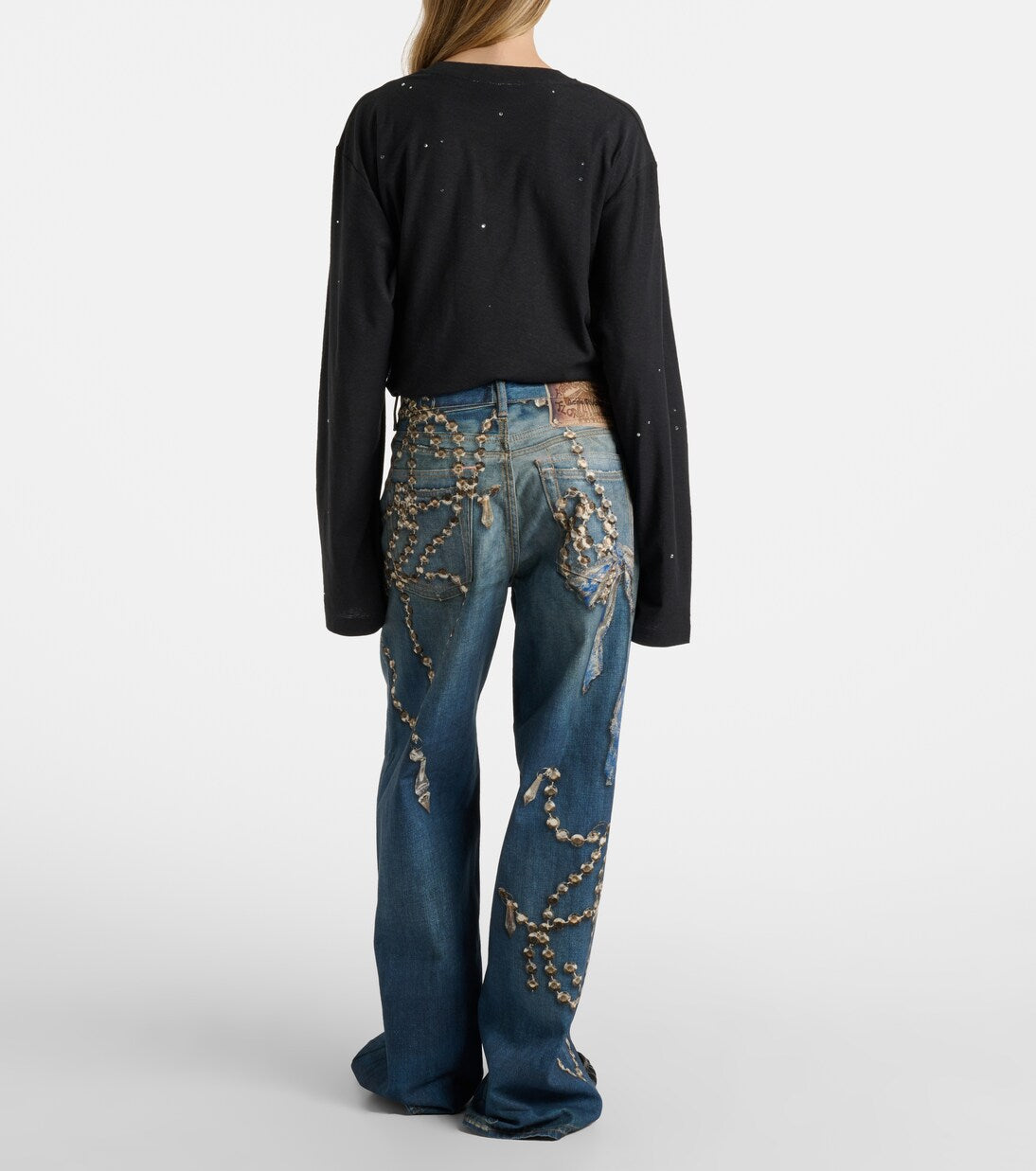 Denim jeans with an illusion print of crystals and bows