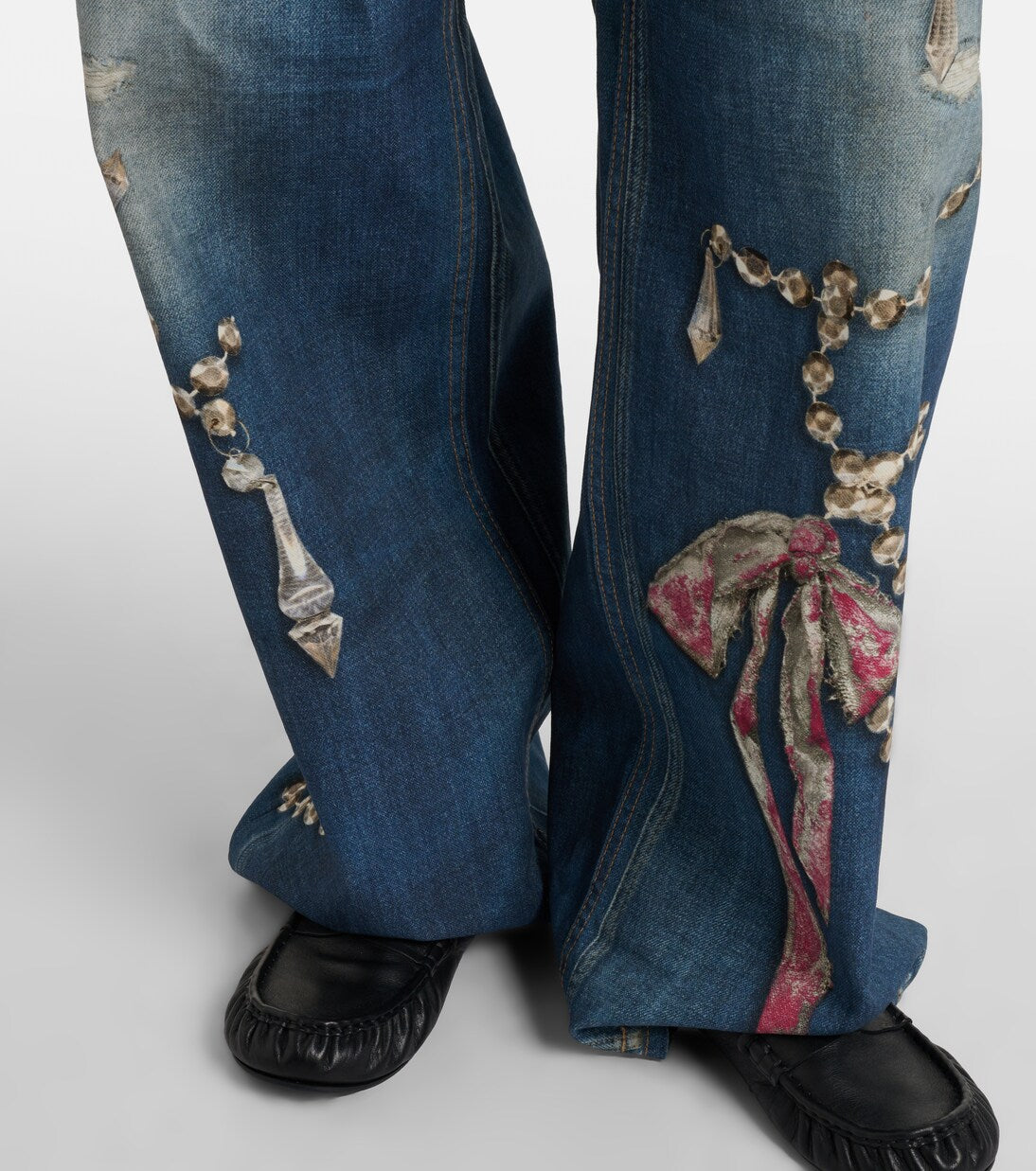 Denim jeans with an illusion print of crystals and bows