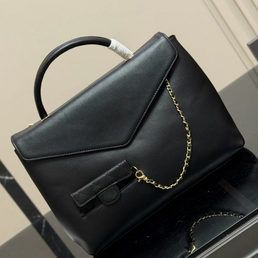 Large-capacity handbag with a matching small wallet.