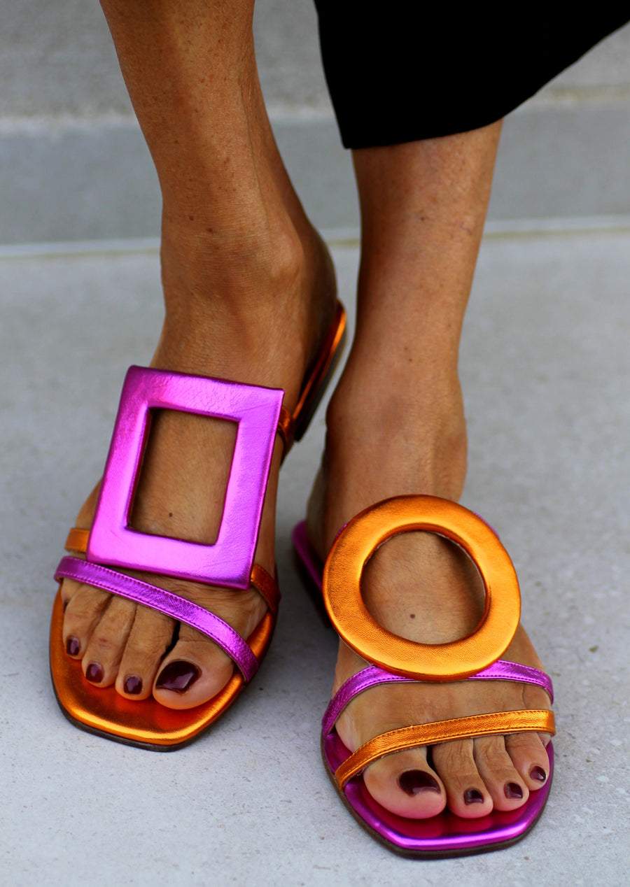 Asymmetric metallic sandals